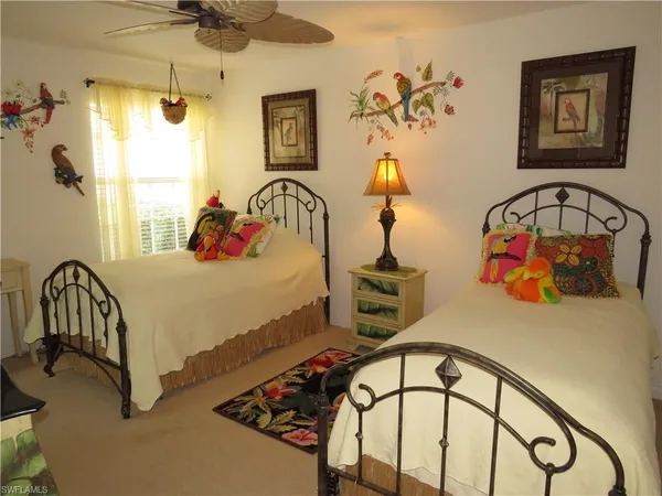 a bedroom with bed and a window