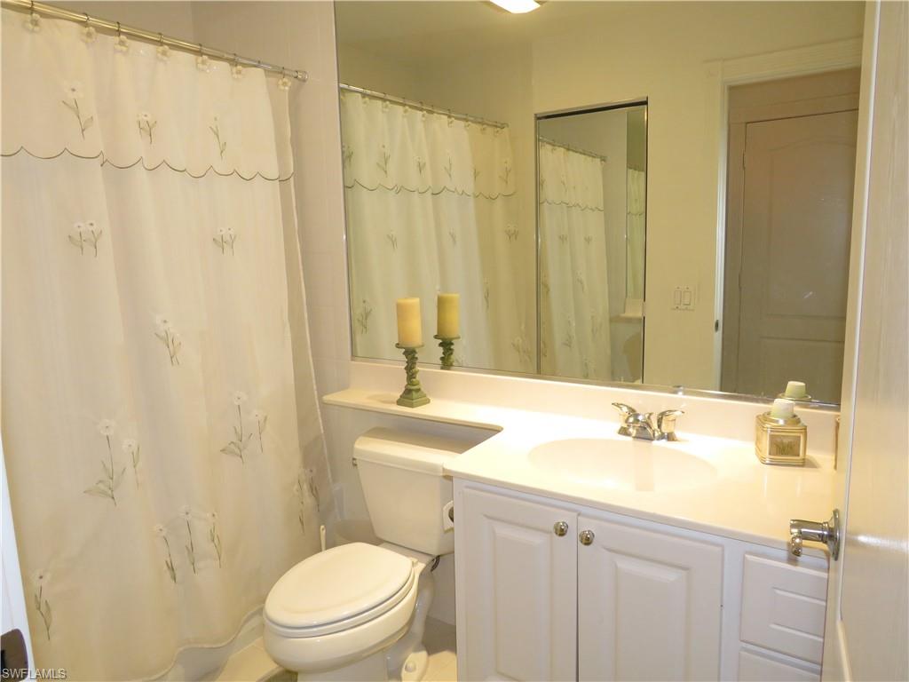 3732 Exuma Way Naples, FL 34119 - Photo 13 of 24 a bathroom with a sink a toilet and shower
