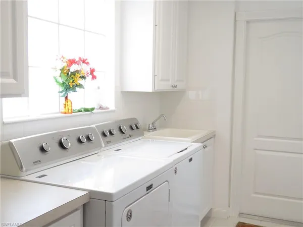 a utility room with washer and dryer