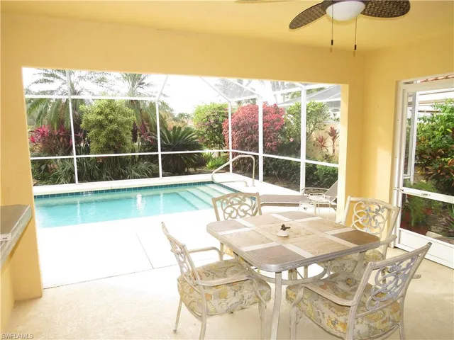 a view of a swimming pool with a lounge chair