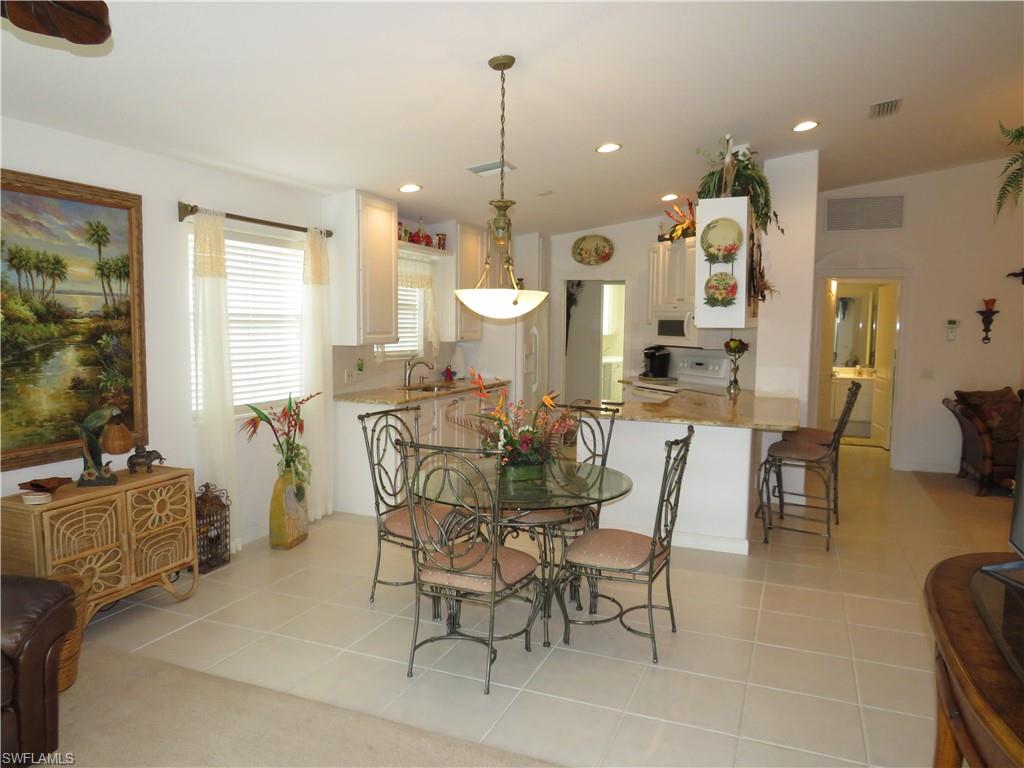 3732 Exuma Way Naples, FL 34119 - Photo 5 of 24 a view of a dining room with furniture