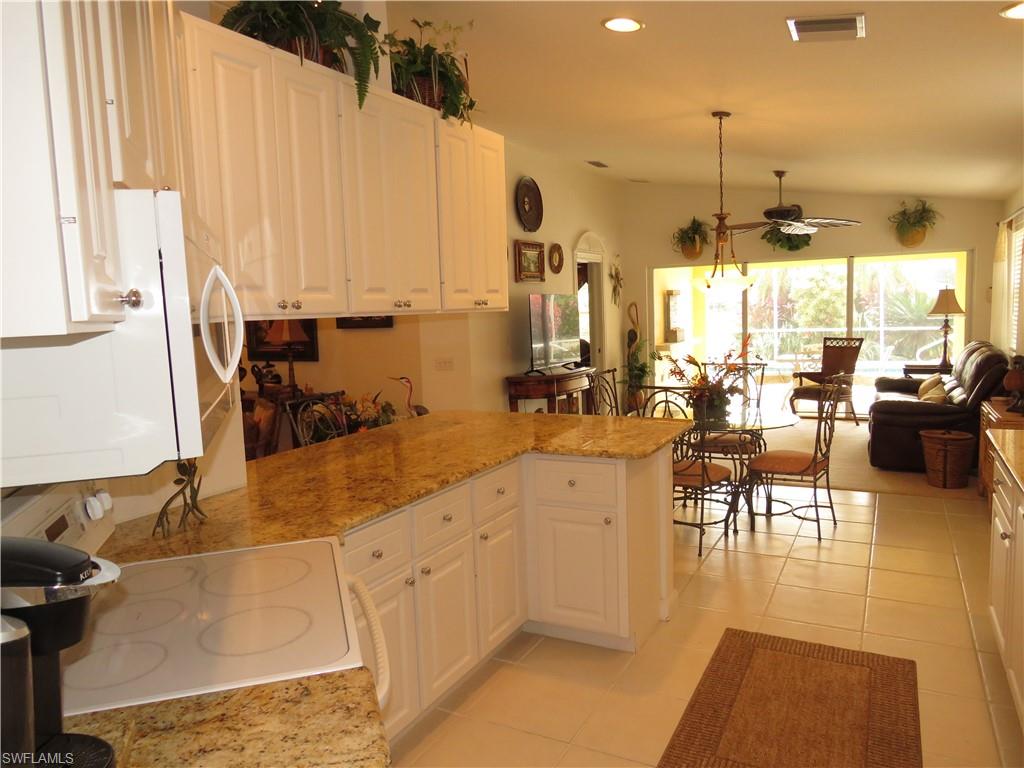 3732 Exuma Way Naples, FL 34119 - Photo 7 of 24 a very nice looking dining room with a large window