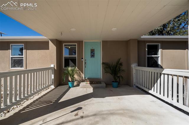 5860 Curtis Road Peyton, CO 80831 - Photo 4 of 28 Property entrance with stucco siding