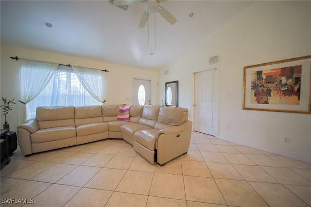 a living room with furniture and a rug