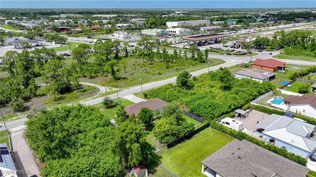 an aerial view of residential houses with outdoor space