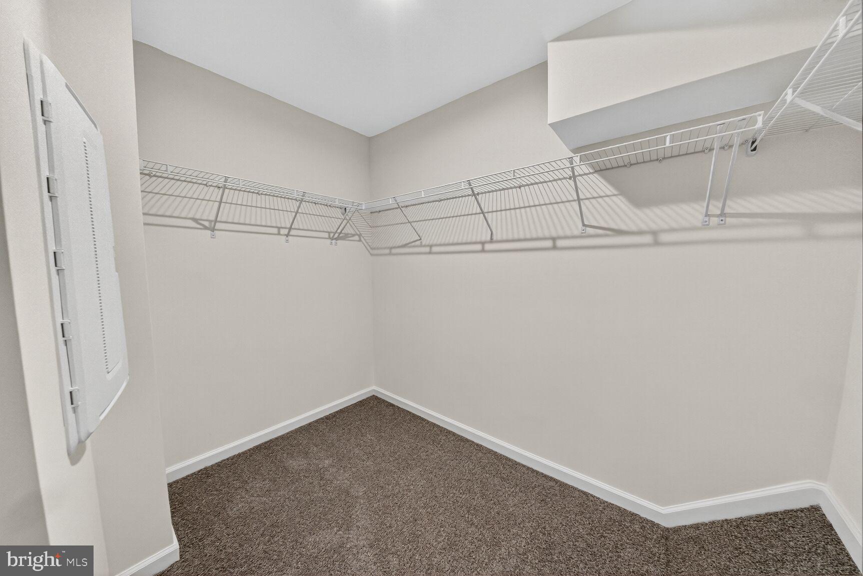 9990 A Justify Run Laurel, MD 20723 - Photo 11 of 28 a view of a room with racks on the wall