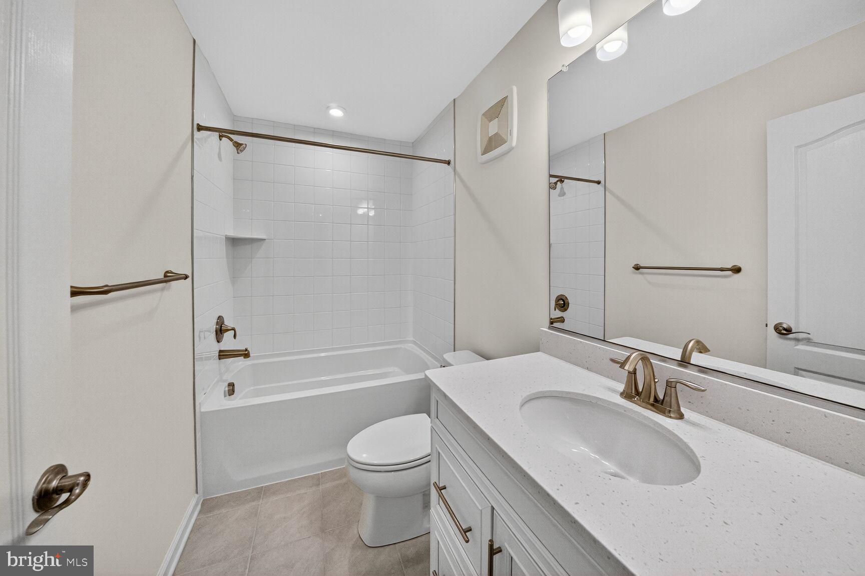 9990 A Justify Run Laurel, MD 20723 - Photo 12 of 28 a bathroom with a sink toilet and shower