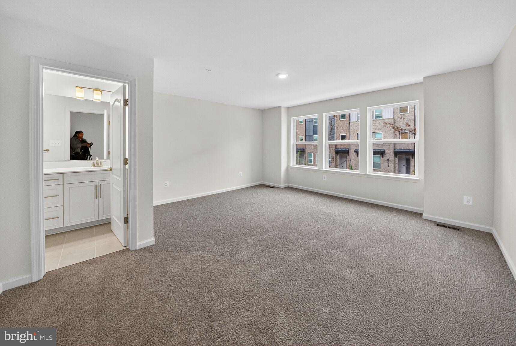 9990 A Justify Run Laurel, MD 20723 - Photo 9 of 28 a view of empty room with a fireplace and entryway