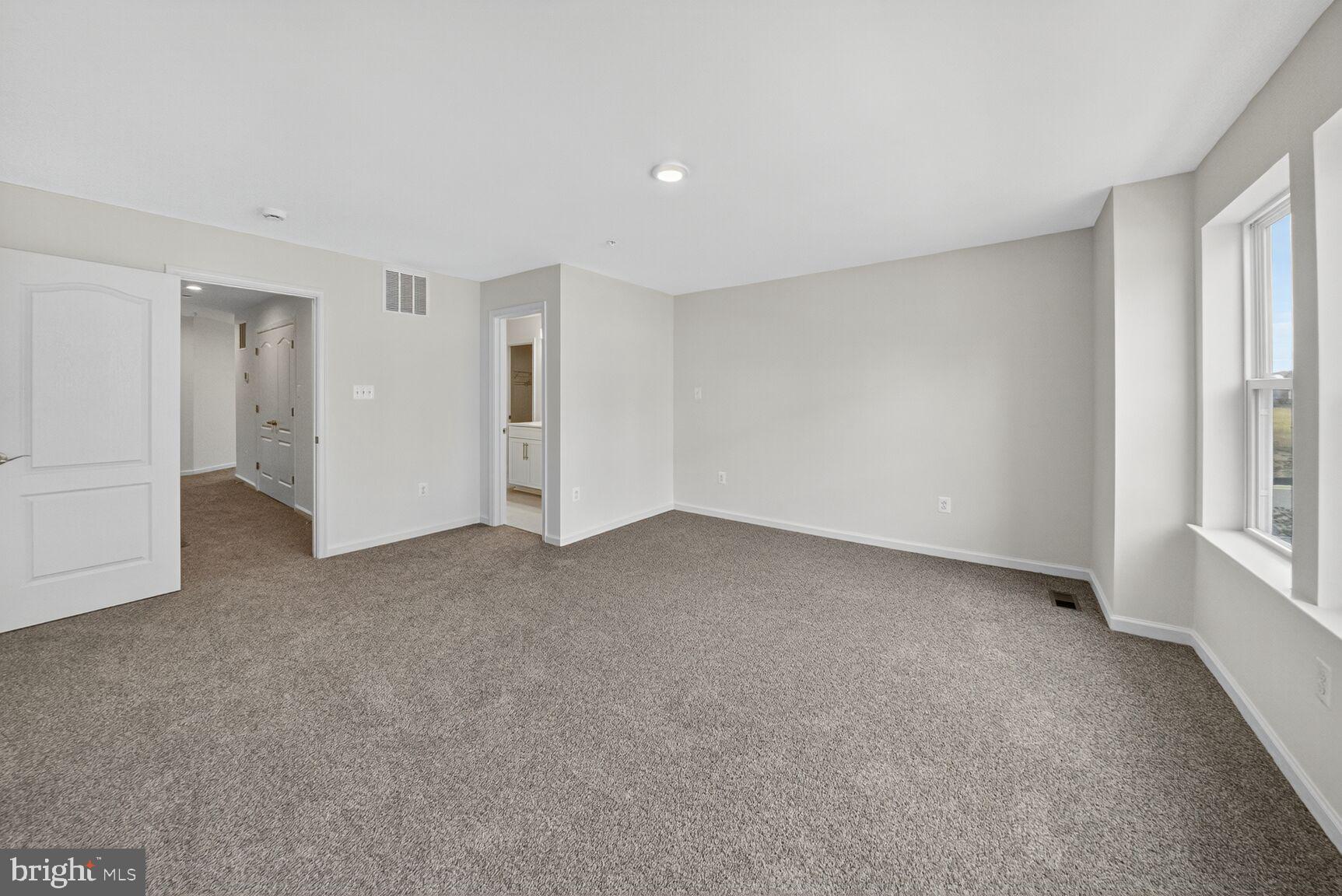 9990 A Justify Run Laurel, MD 20723 - Photo 10 of 28 a view of an empty room with a window