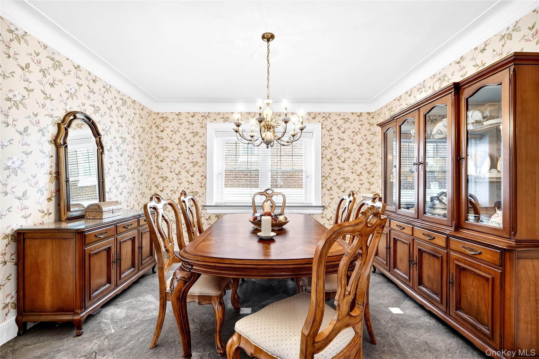 3334 Country Club Road Bronx, NY 10465 - Photo 11 of 49 Dining space with healthy amount of natural light, a chandelier, wallpapered walls, and ornamental molding