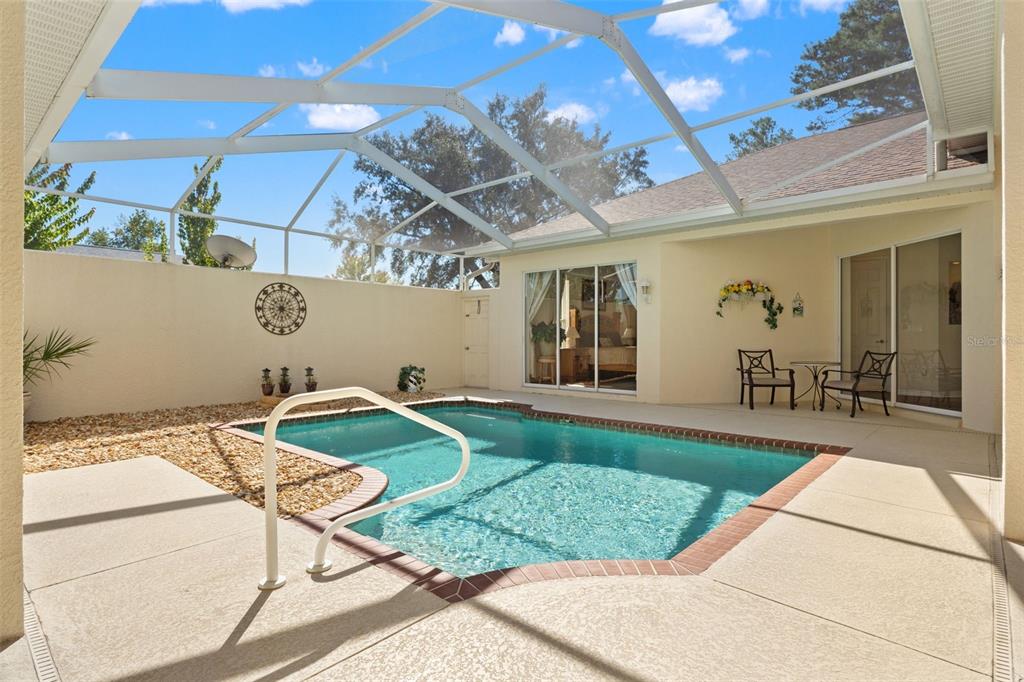 11405 Warm Wind Way Weeki Wachee, FL 34613 - Photo 11 of 46 a front view of a house with garden
