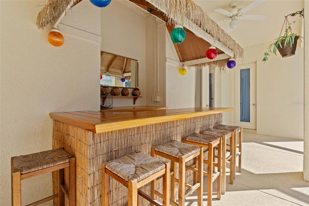 11405 Warm Wind Way Weeki Wachee, FL 34613 - Photo 14 of 46 a view of a dining room with furniture and a kitchen