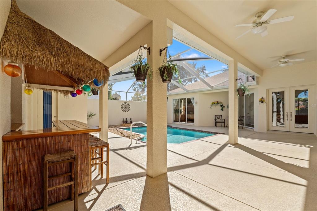 11405 Warm Wind Way Weeki Wachee, FL 34613 - Photo 15 of 46 a view of a patio with table and chairs