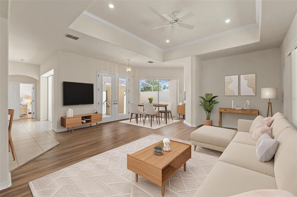 11405 Warm Wind Way Weeki Wachee, FL 34613 - Photo 17 of 46 a living room with furniture and a flat screen tv
