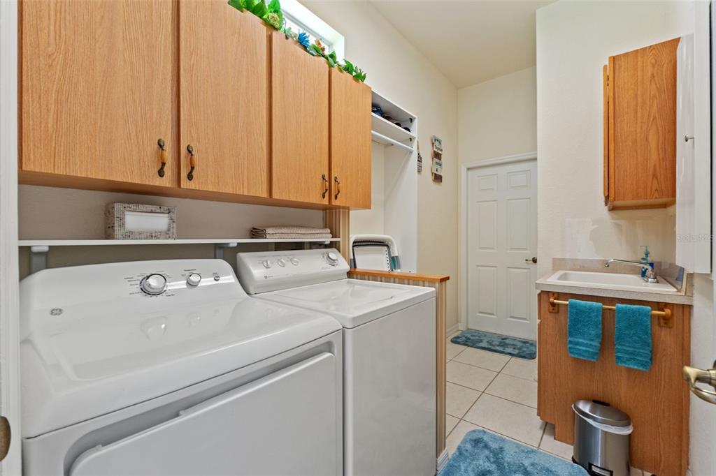 11405 Warm Wind Way Weeki Wachee, FL 34613 - Photo 34 of 46 a bathroom with a sink and a mirror