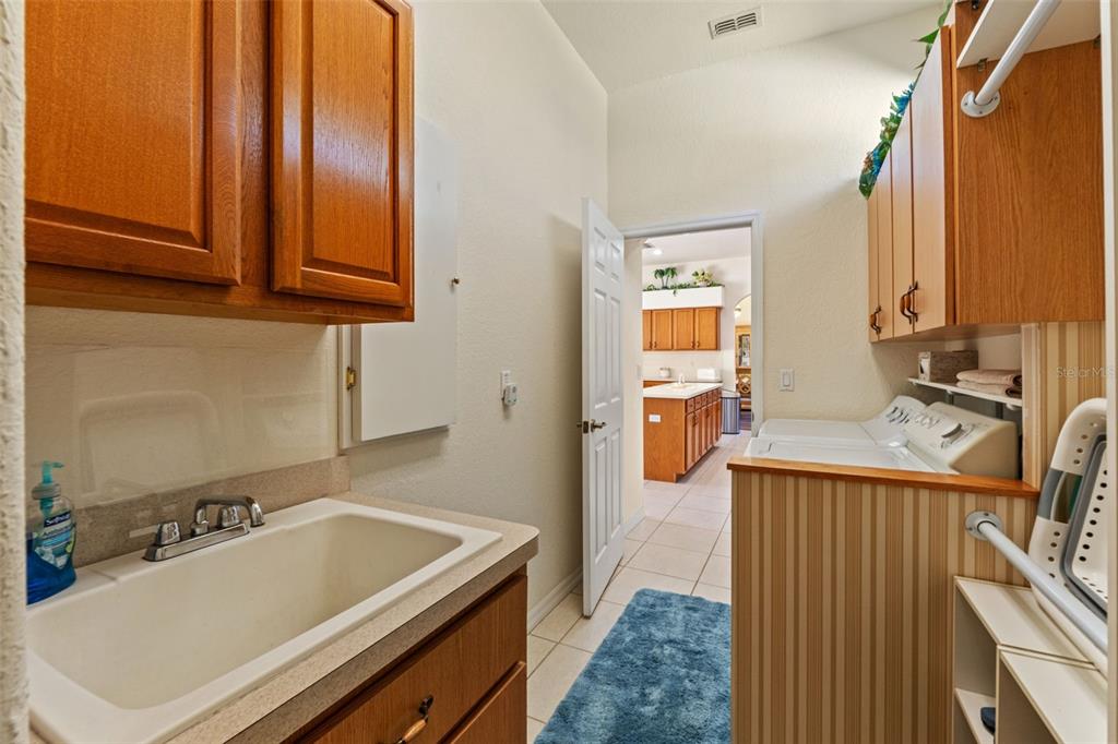 11405 Warm Wind Way Weeki Wachee, FL 34613 - Photo 35 of 46 a bathroom with a tub sink and mirror