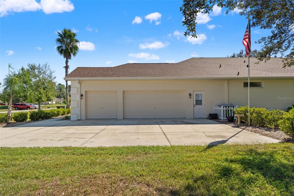11405 Warm Wind Way Weeki Wachee, FL 34613 - Photo 42 of 46 a house view with a garden space