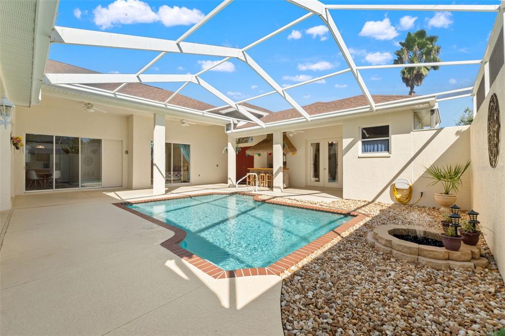 11405 Warm Wind Way Weeki Wachee, FL 34613 - Photo 10 of 46 front view of a house with swimming pool