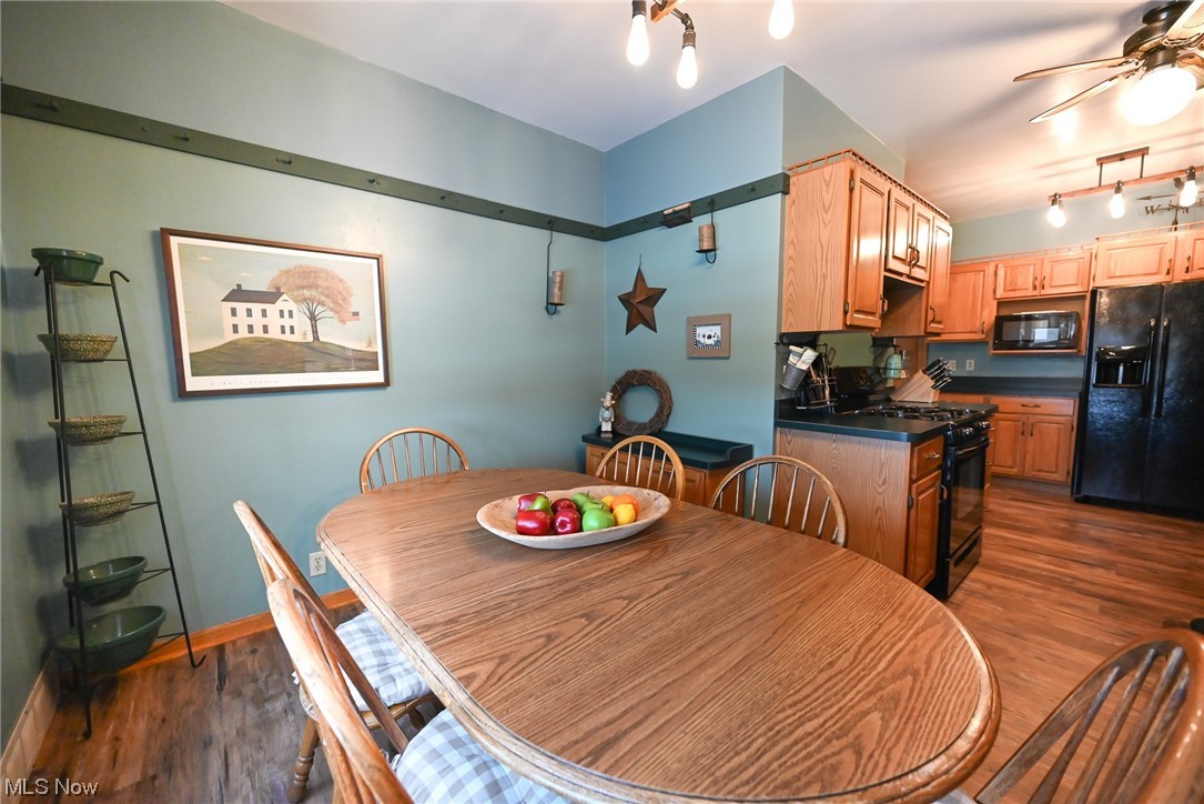 4436 Ridge Road Brooklyn, OH 44144 - Photo 14 of 33 eat in kitchen space with newer flooring, and ceiling fan