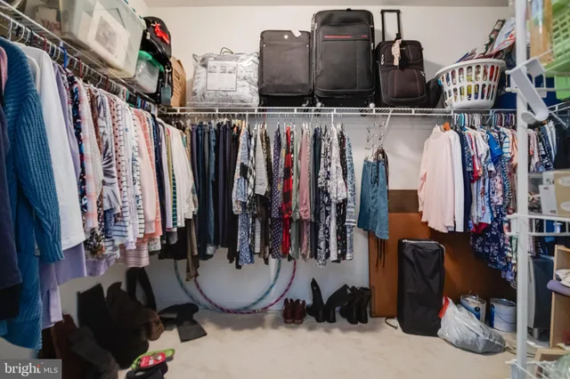 a en suite bathroom with a granite countertop sink and a mirror