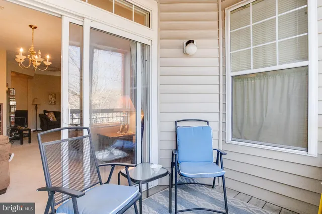 a view of porch with a bench