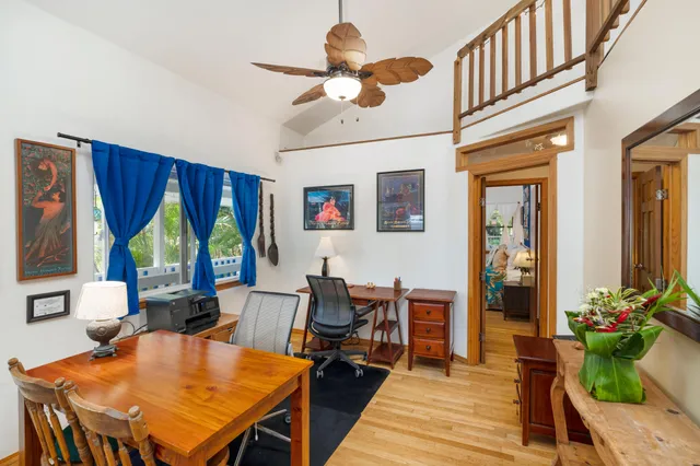 a living room with furniture a rug and a chandelier