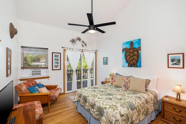 a bedroom with bed and window