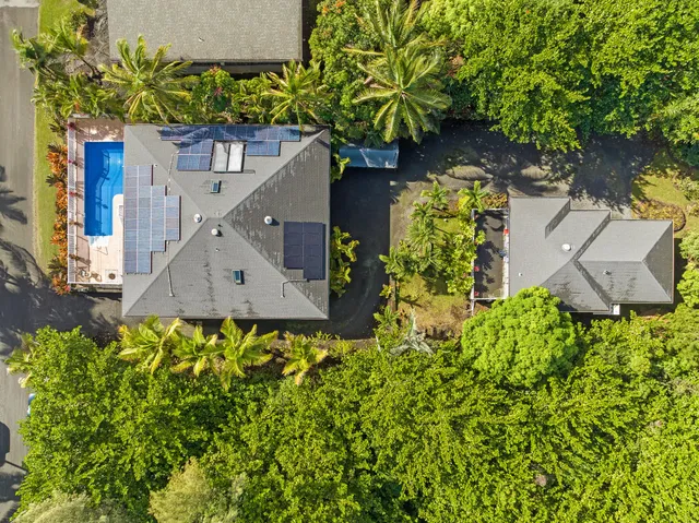 a view of a house with a flower garden