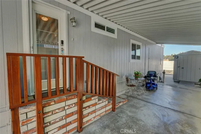 a backyard of a house with yard and outdoor seating