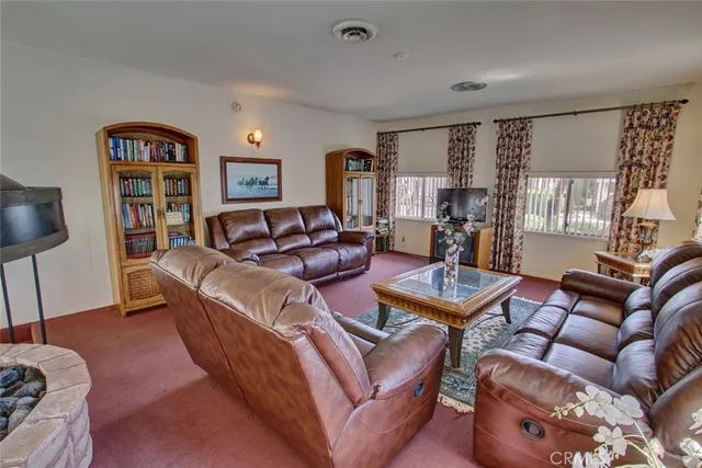 a room with furniture and pool table