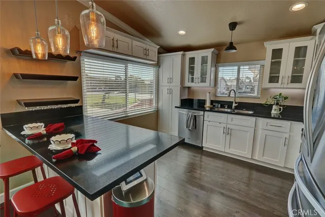 a kitchen with a refrigerator stove and microwave