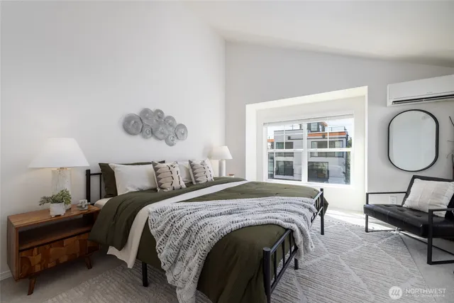 a bed room with a bed and a chair