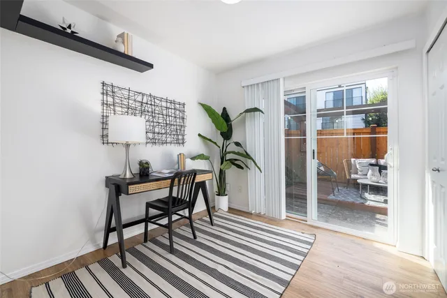 a workspace with furniture and a potted plant