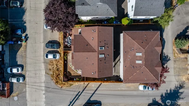 an aerial view of residential houses with outdoor space