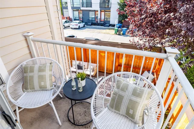 a view of balcony with furniture