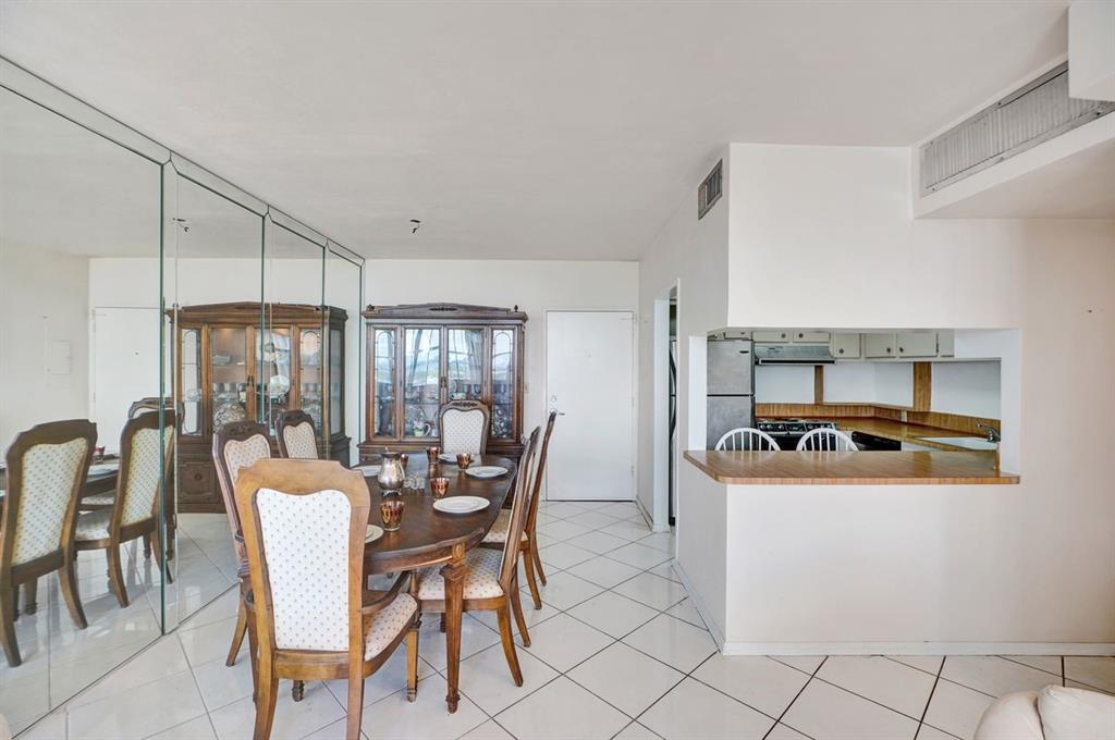 7441 Wayne Avenue, Unit 10C Miami Beach, FL 33141 - Photo 18 of 86 a dining room with furniture and window