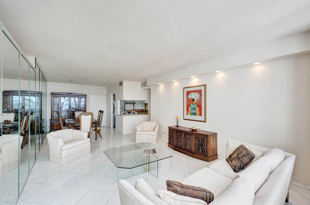 7441 Wayne Avenue, Unit 10C Miami Beach, FL 33141 - Photo 19 of 86 a living room with furniture and a flat screen tv