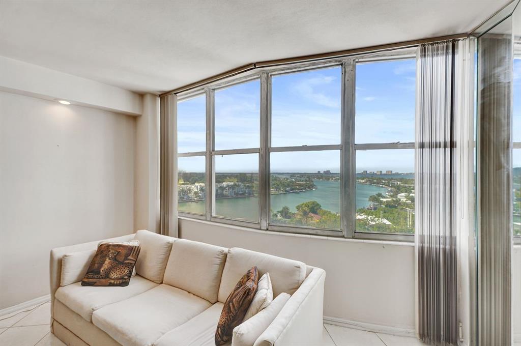 7441 Wayne Avenue, Unit 10C Miami Beach, FL 33141 - Photo 21 of 86 a living room with furniture and a window