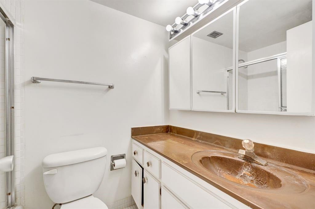 7441 Wayne Avenue, Unit 10C Miami Beach, FL 33141 - Photo 30 of 86 a bathroom with a sink and a toilet