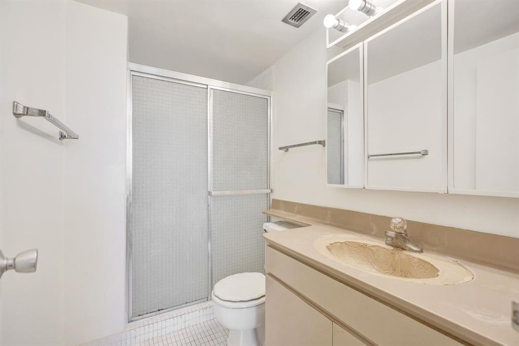 7441 Wayne Avenue, Unit 10C Miami Beach, FL 33141 - Photo 40 of 86 a bathroom with a sink and a toilet