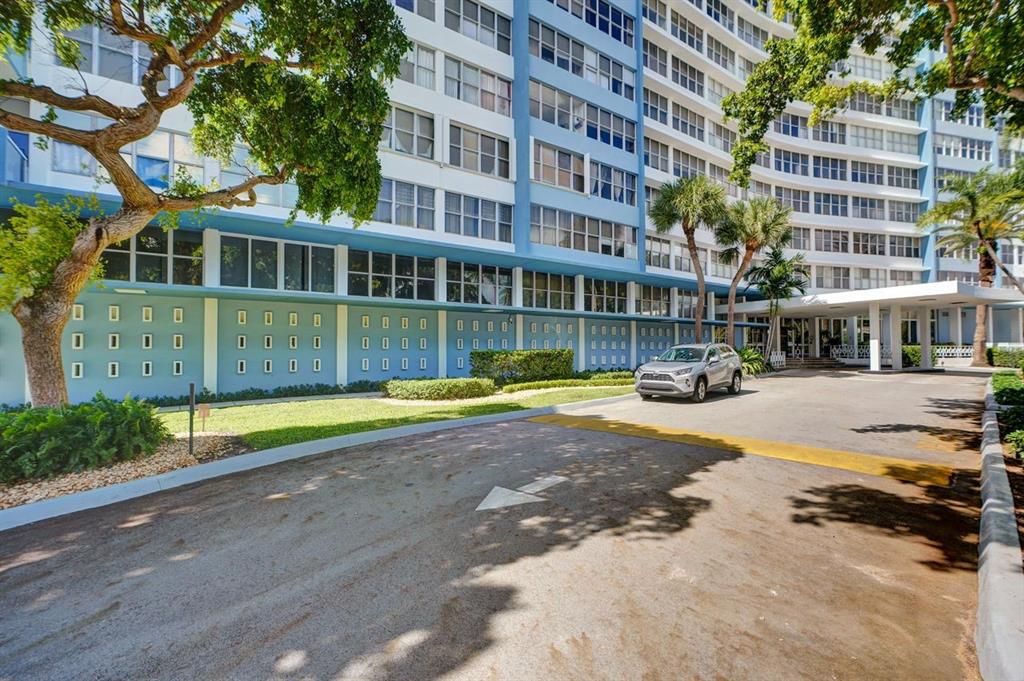 7441 Wayne Avenue, Unit 10C Miami Beach, FL 33141 - Photo 52 of 86 a front view of a building with a swimming pool