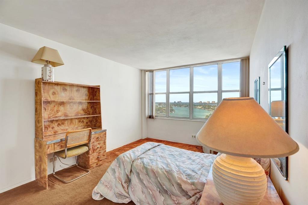 7441 Wayne Avenue, Unit 10C Miami Beach, FL 33141 - Photo 9 of 86 a bedroom with a bed and a window