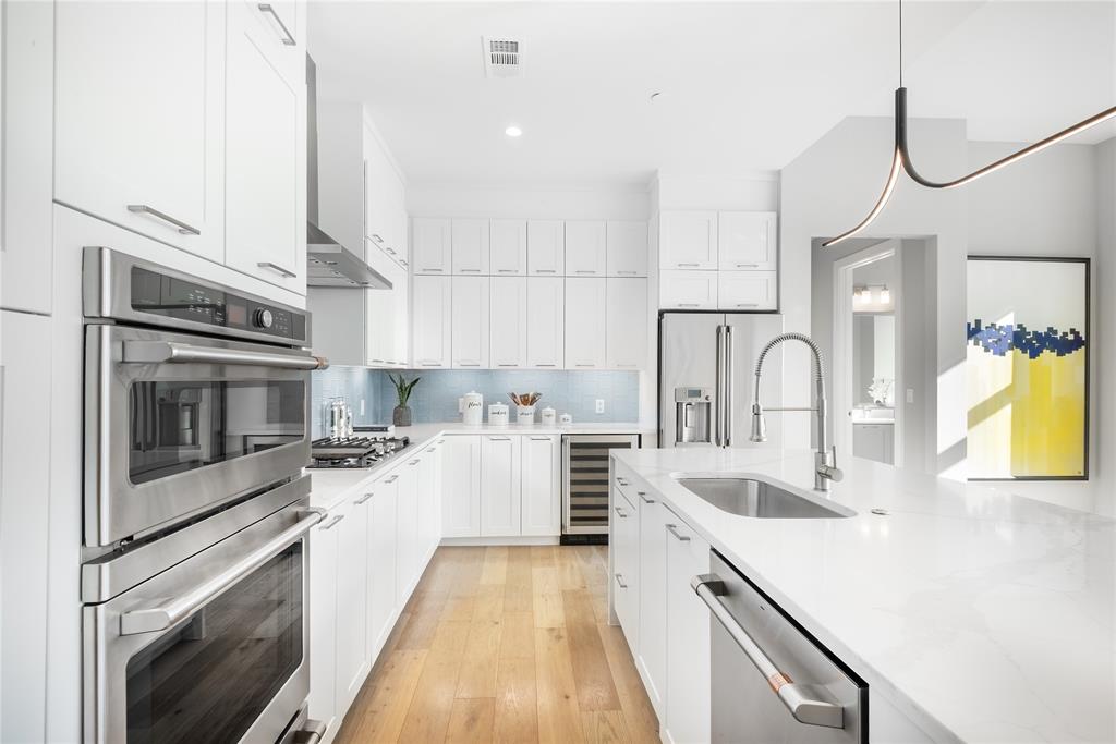 3031 Oliver Street, Unit 2007 Dallas, TX 75205 - Photo 2 of 29 a kitchen with a sink stove and oven