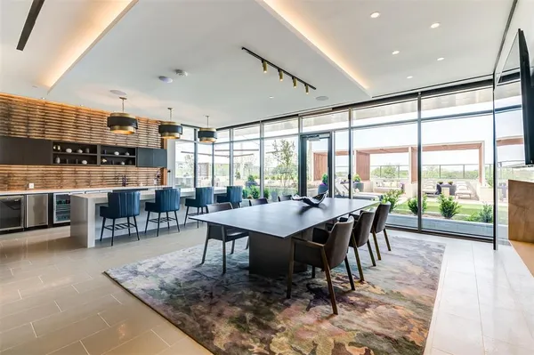 a dining room with furniture and wooden floor