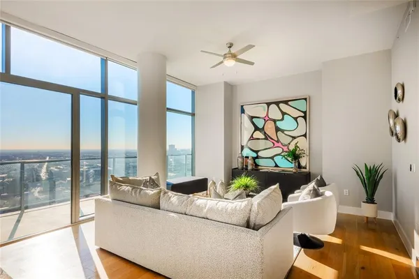 a living room with furniture and a large window
