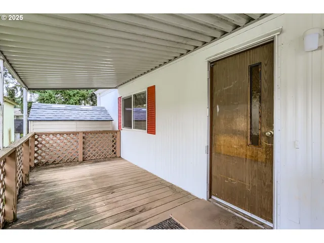 a view of wooden floor in front of a house