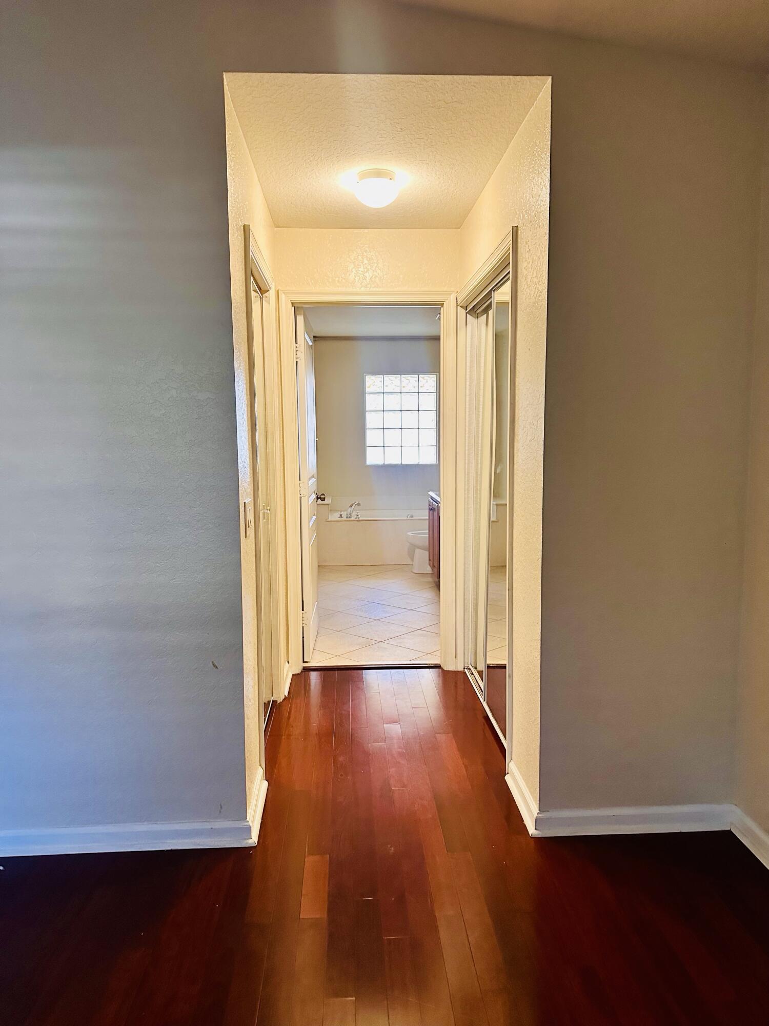 5200 Rising Comet Lane Greenacres, FL 33463 - Photo 20 of 50 a view of a hallway with wooden floor