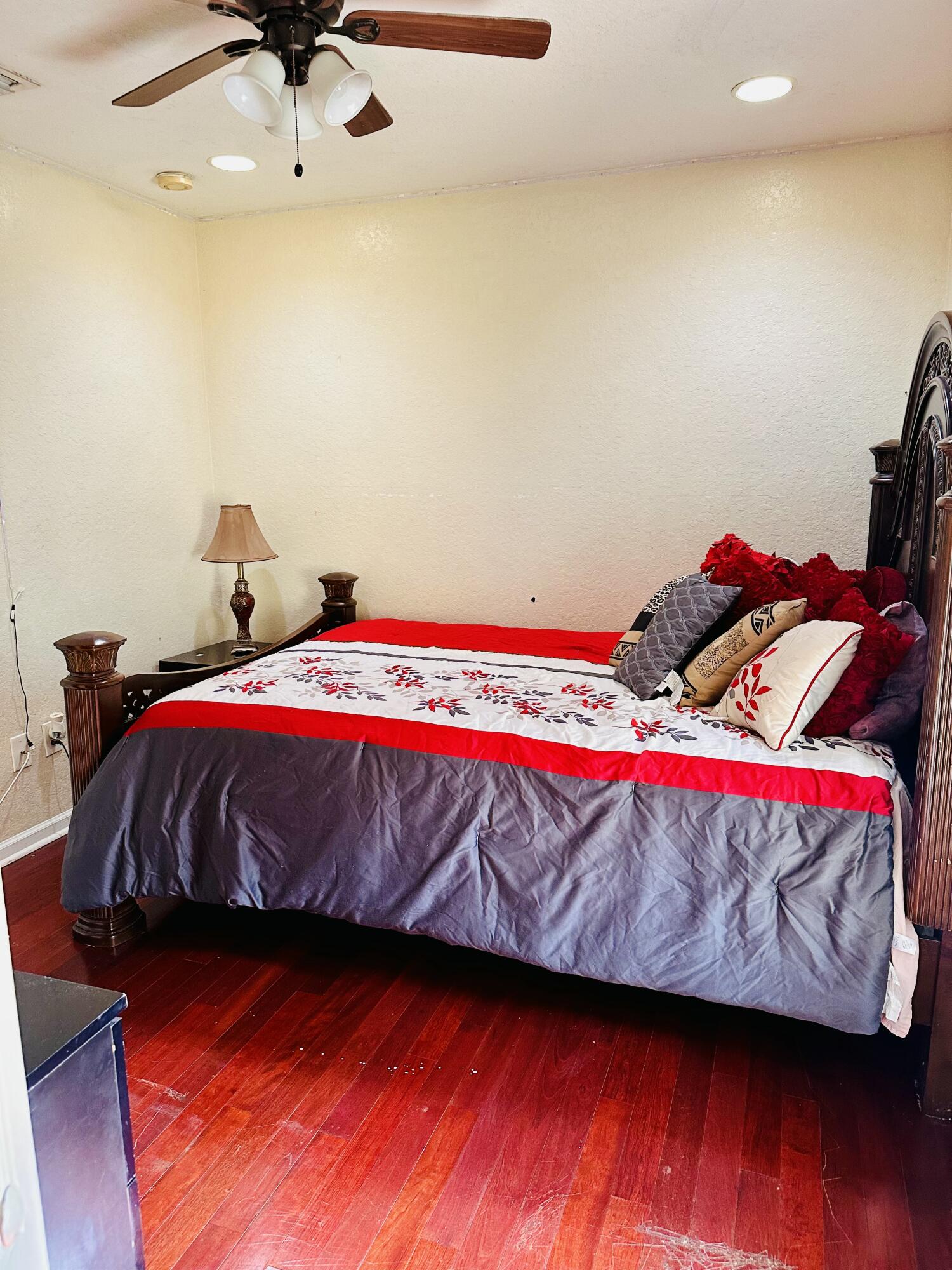 5200 Rising Comet Lane Greenacres, FL 33463 - Photo 26 of 50 a bedroom with a bed and wooden floor