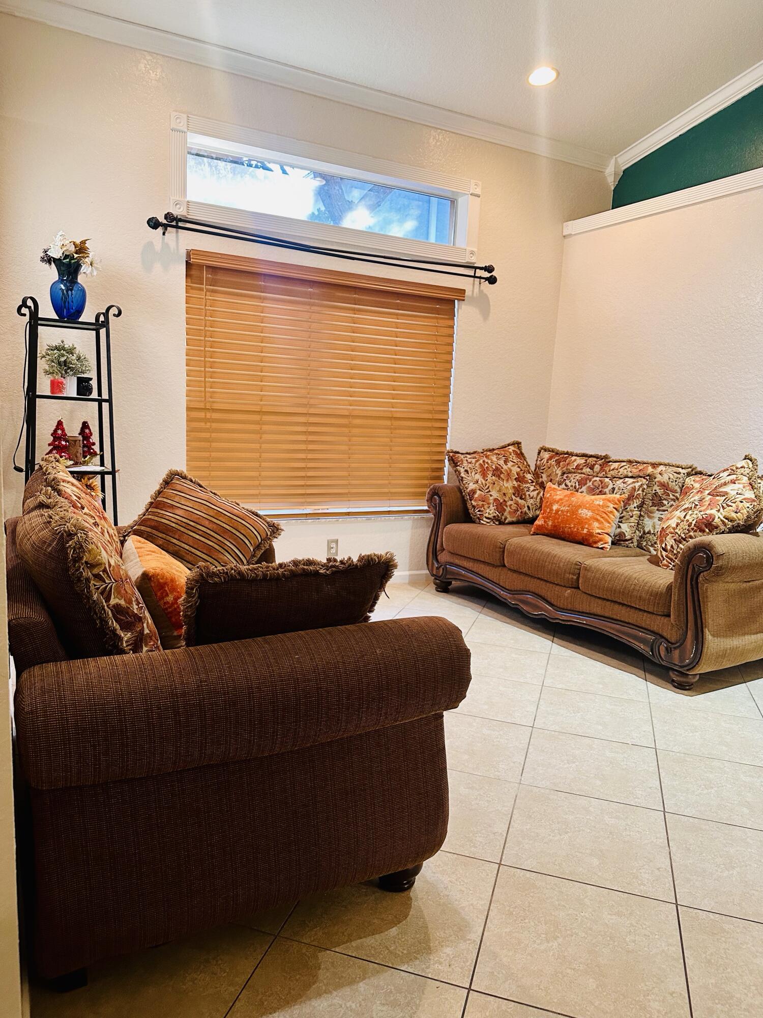 5200 Rising Comet Lane Greenacres, FL 33463 - Photo 6 of 50 a living room with furniture and a window