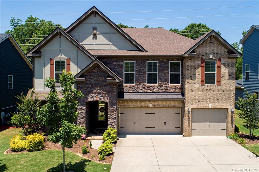 1452 Cilantro Court Tega Cay, SC 29708 - Photo 1 of 48 a front view of a house with a garden